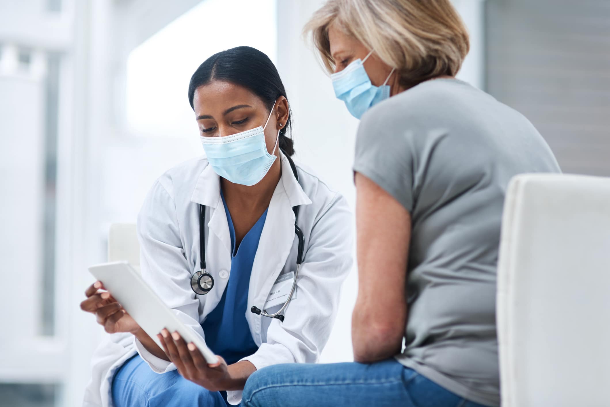 masked doctor and patient