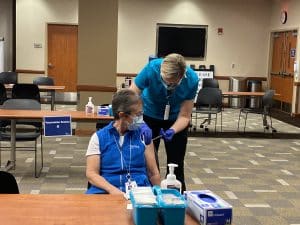 woman receiving covid vaccine