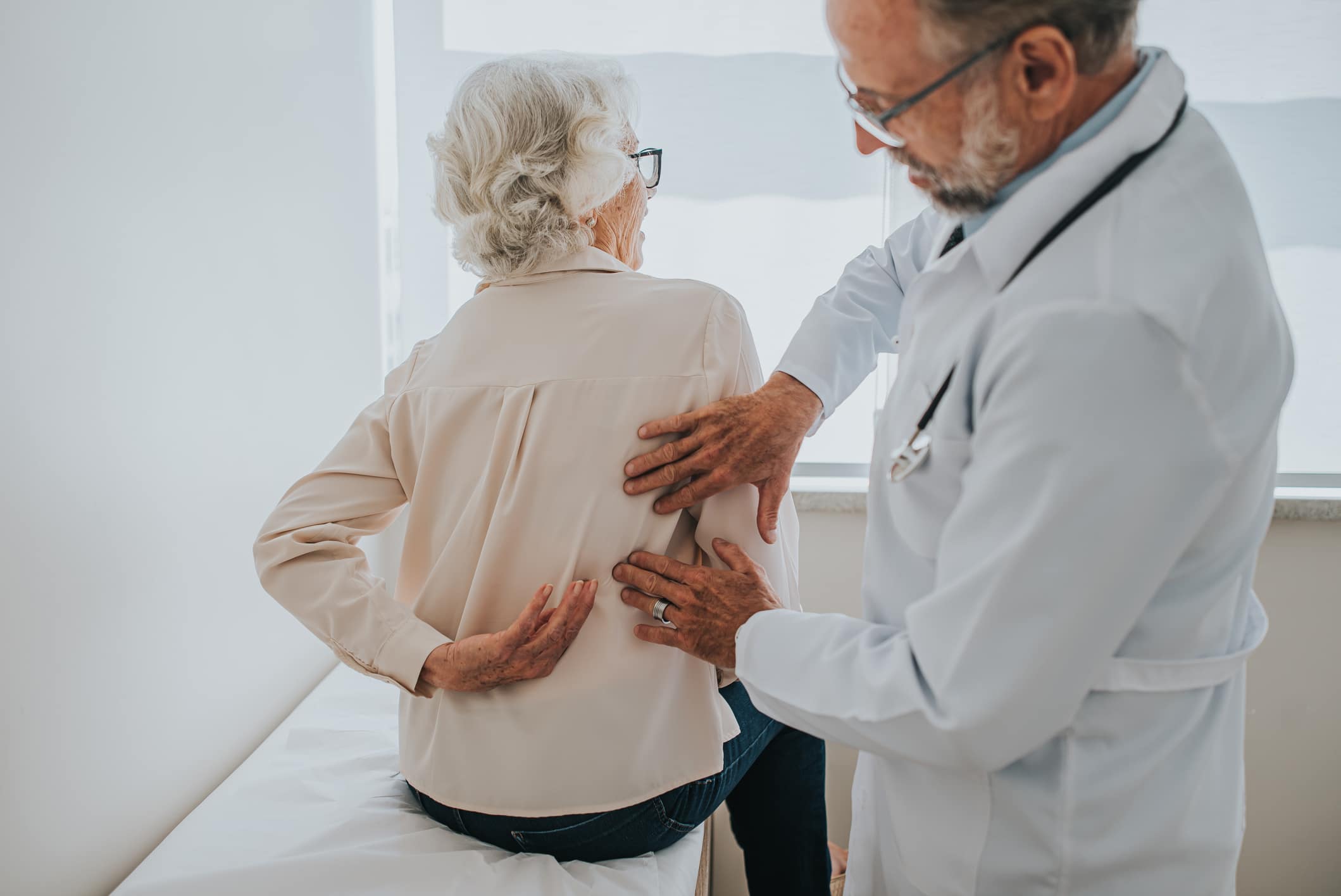 woman examined by back doctor